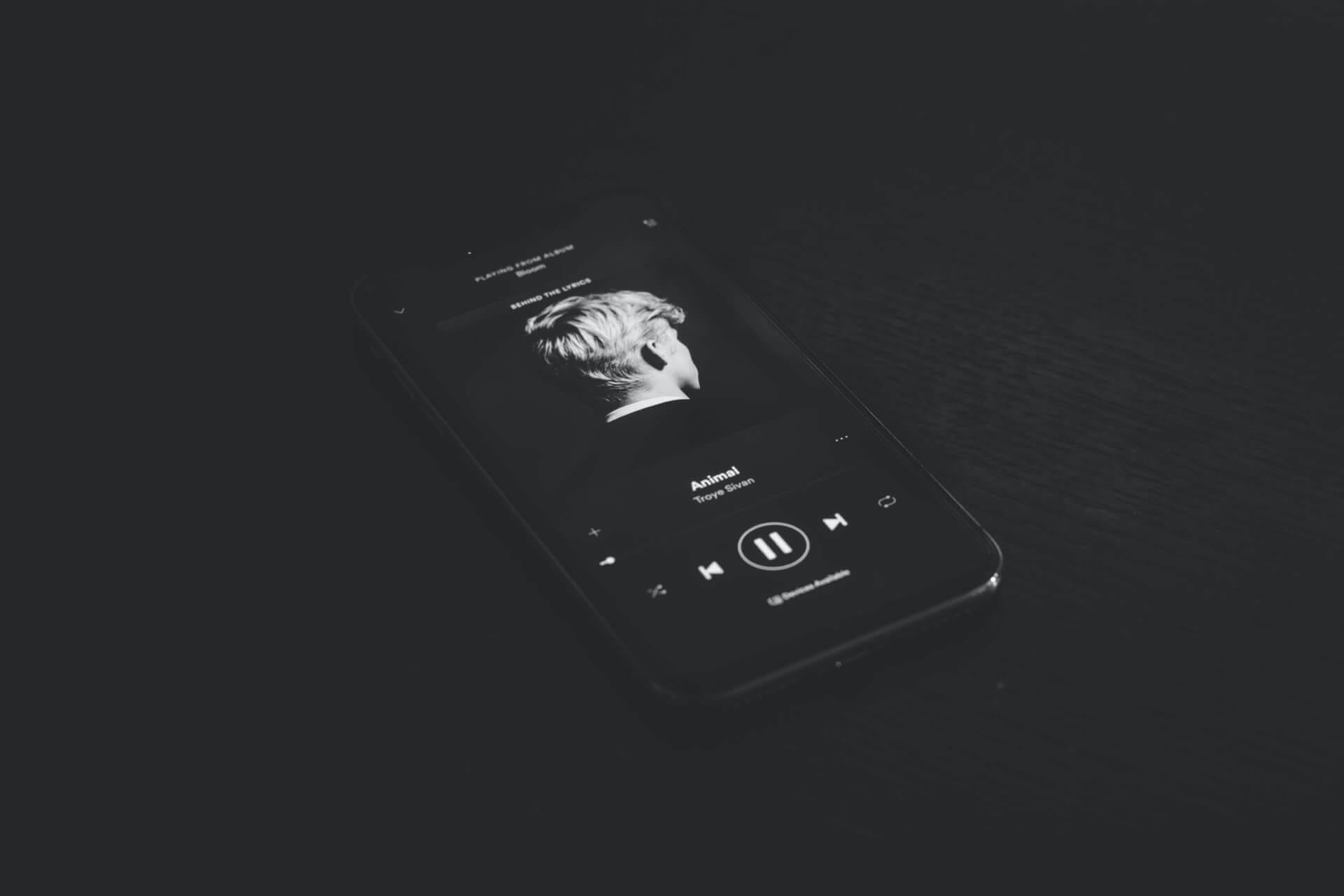 Smartphone playing music in black and white.