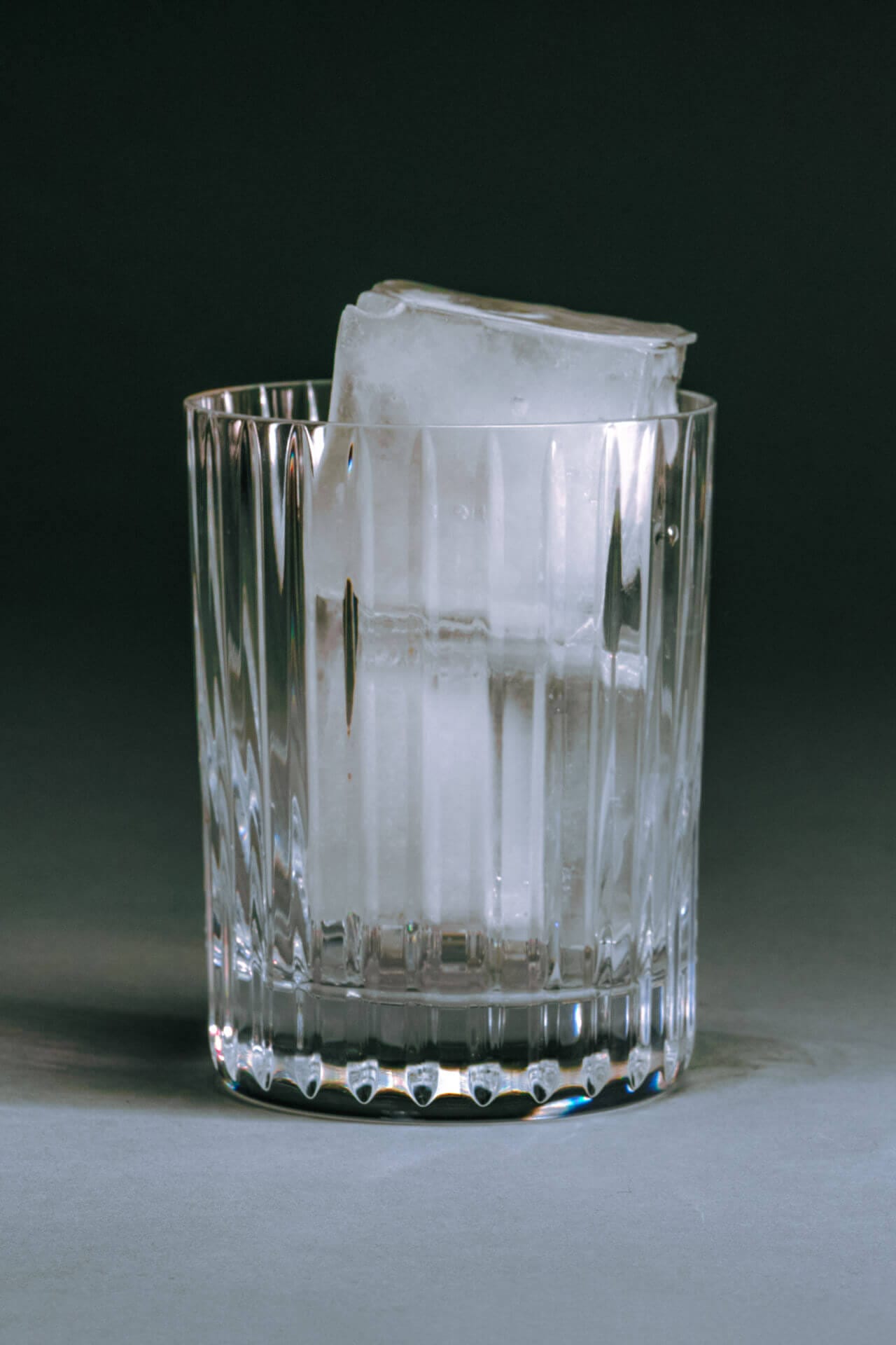 Glass with large ice cubes inside.
