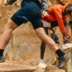 People hiking on a rocky terrain.