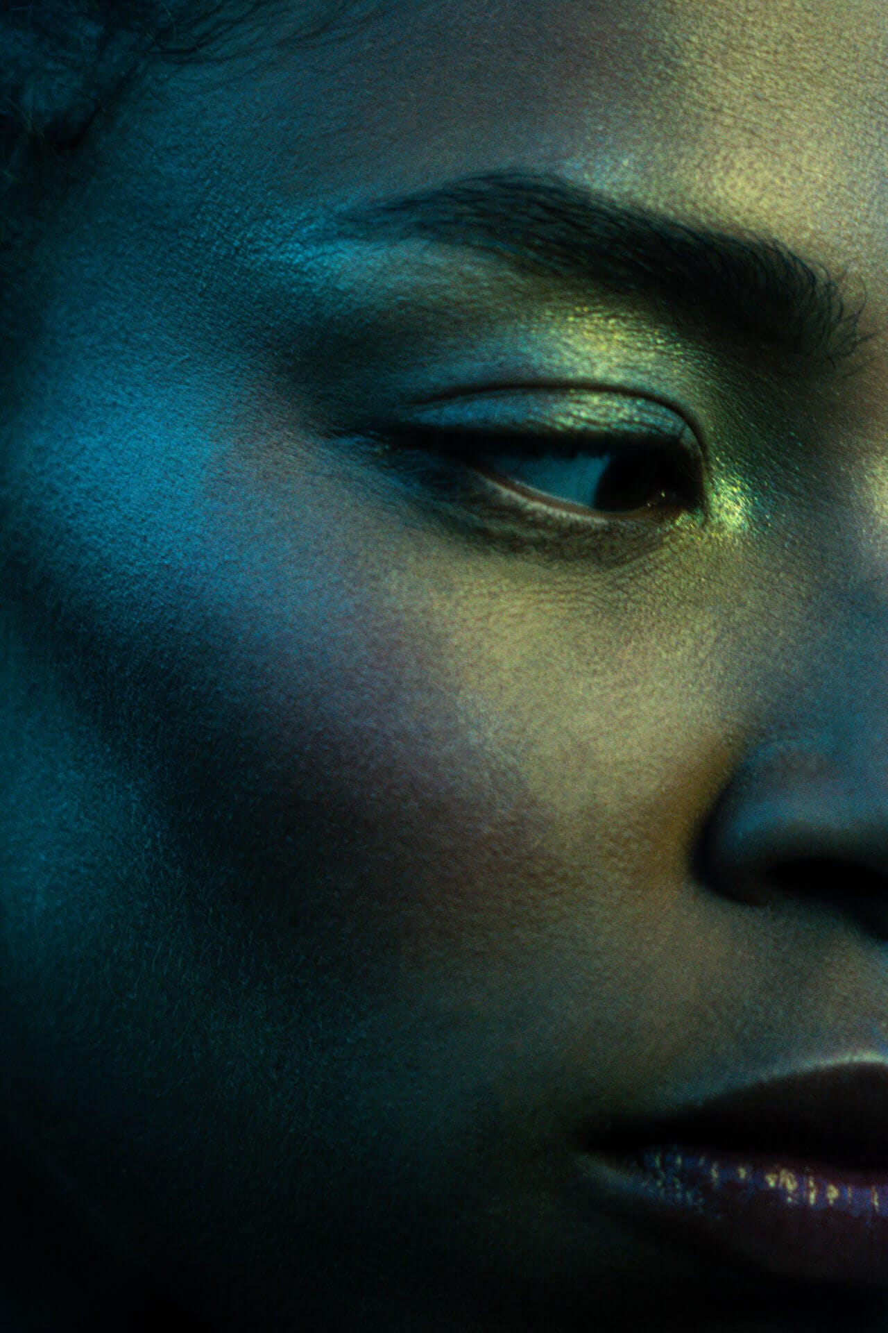 Close-up of woman's face in shadow.