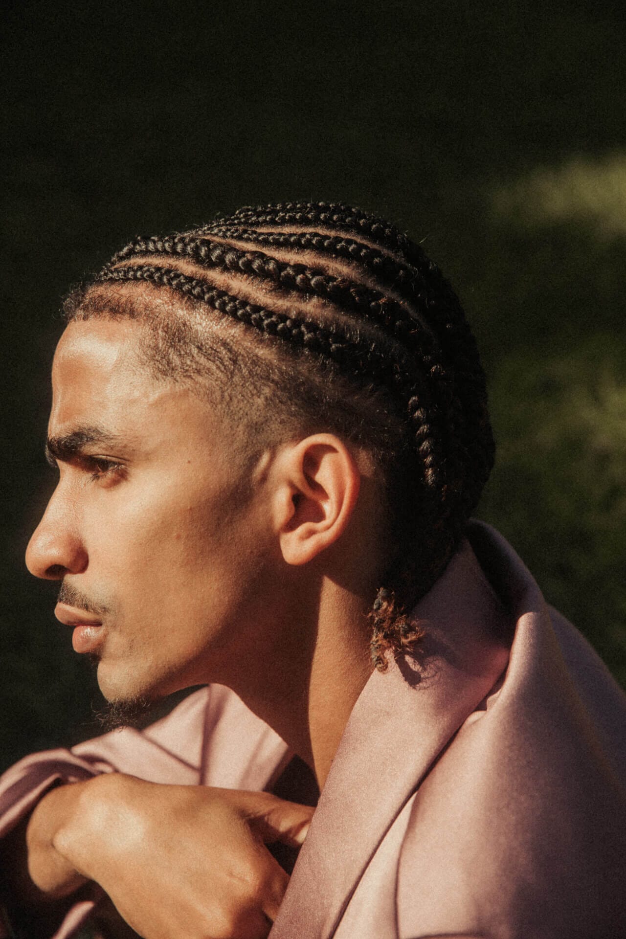 Profile of person with braided hair.